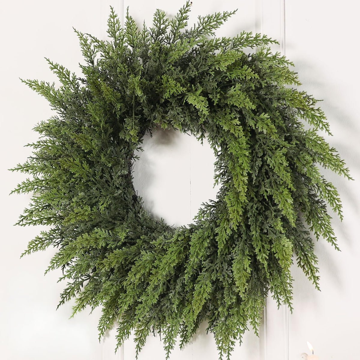 FOTEEWL wreath on front door showcases realistic cedar look and curb appeal