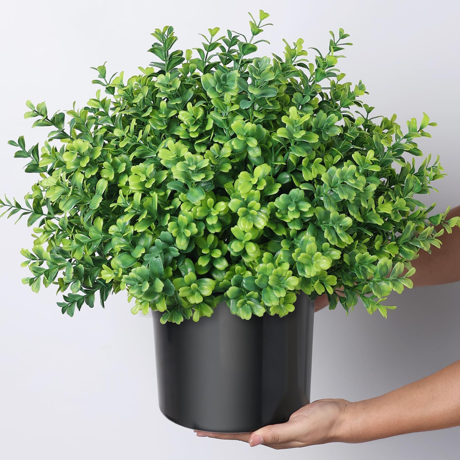 FOTEEWL topiary beside a chair to show 17 inch scale and proportional fit