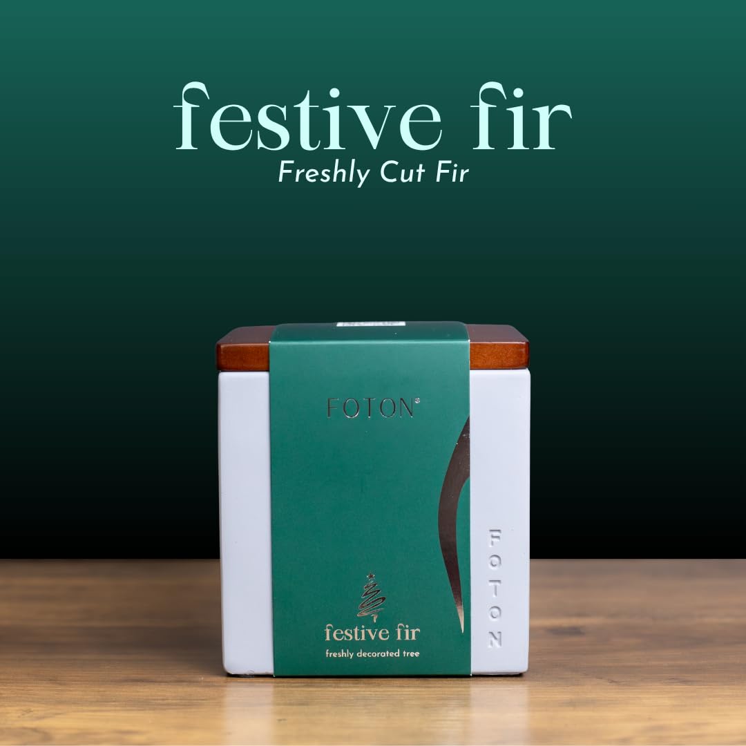 Foton candle lit on table creating soft ambient glow and calming festive fragrance