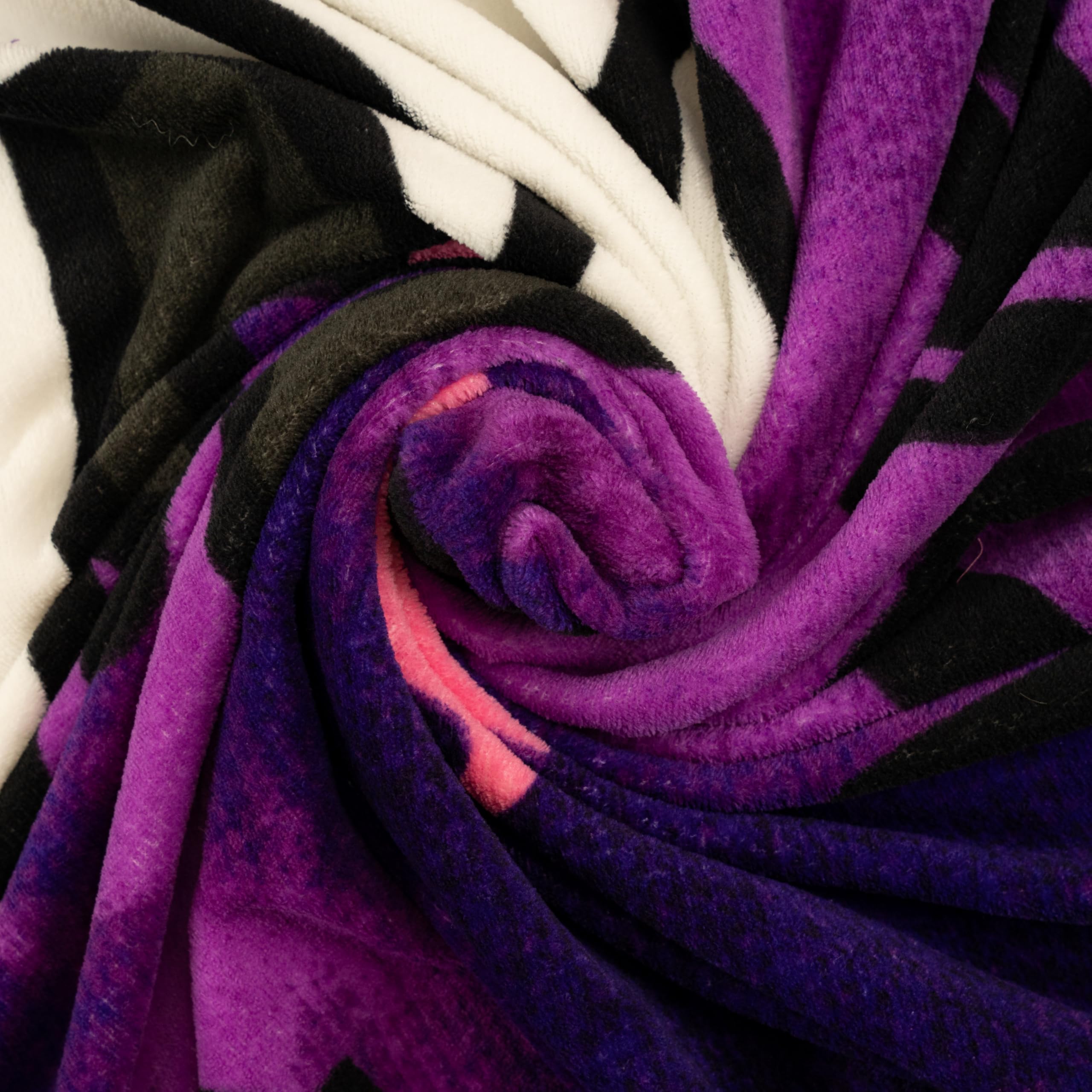Franco Kuromi folded next to a pillow to show scale and easy storage