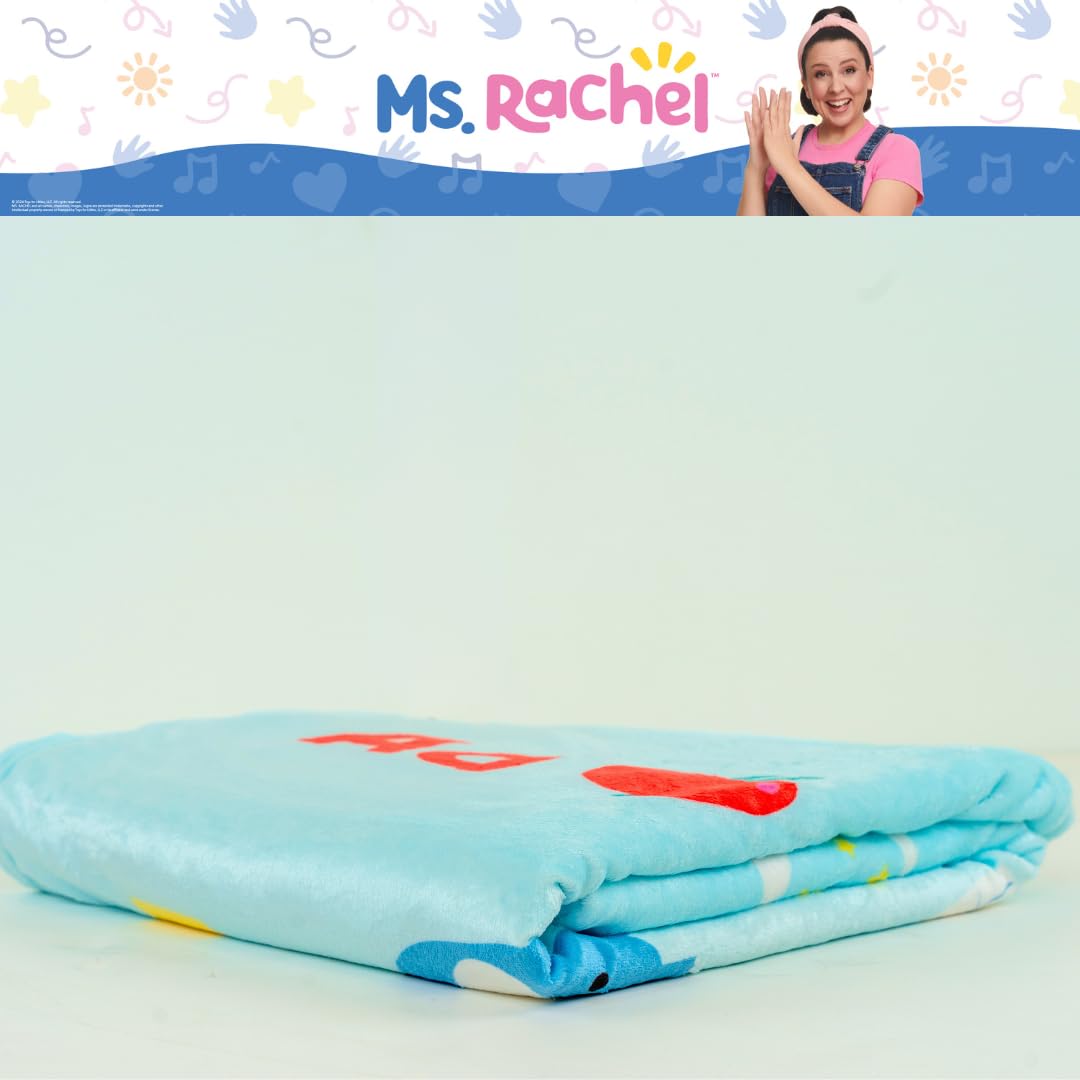 Franco Ms. Rachel blanket draped beside child for size and coverage reference