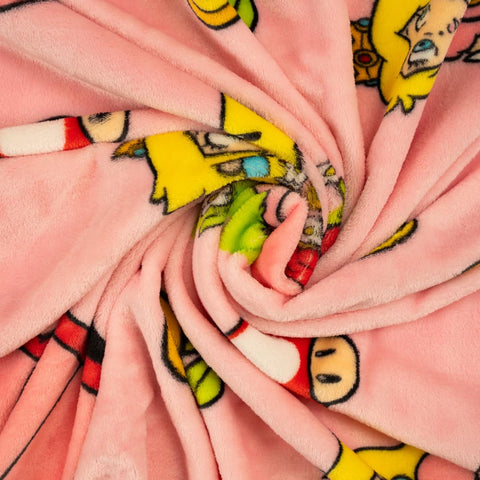Franco Princess Peach throw with child snuggling, illustrating warmth and kid-friendly design