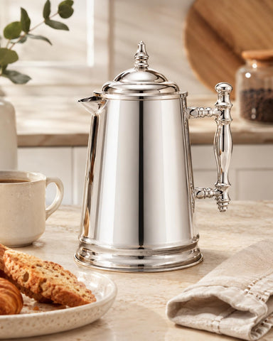 Francois et Mimi French press pouring coffee into mug for easy serving