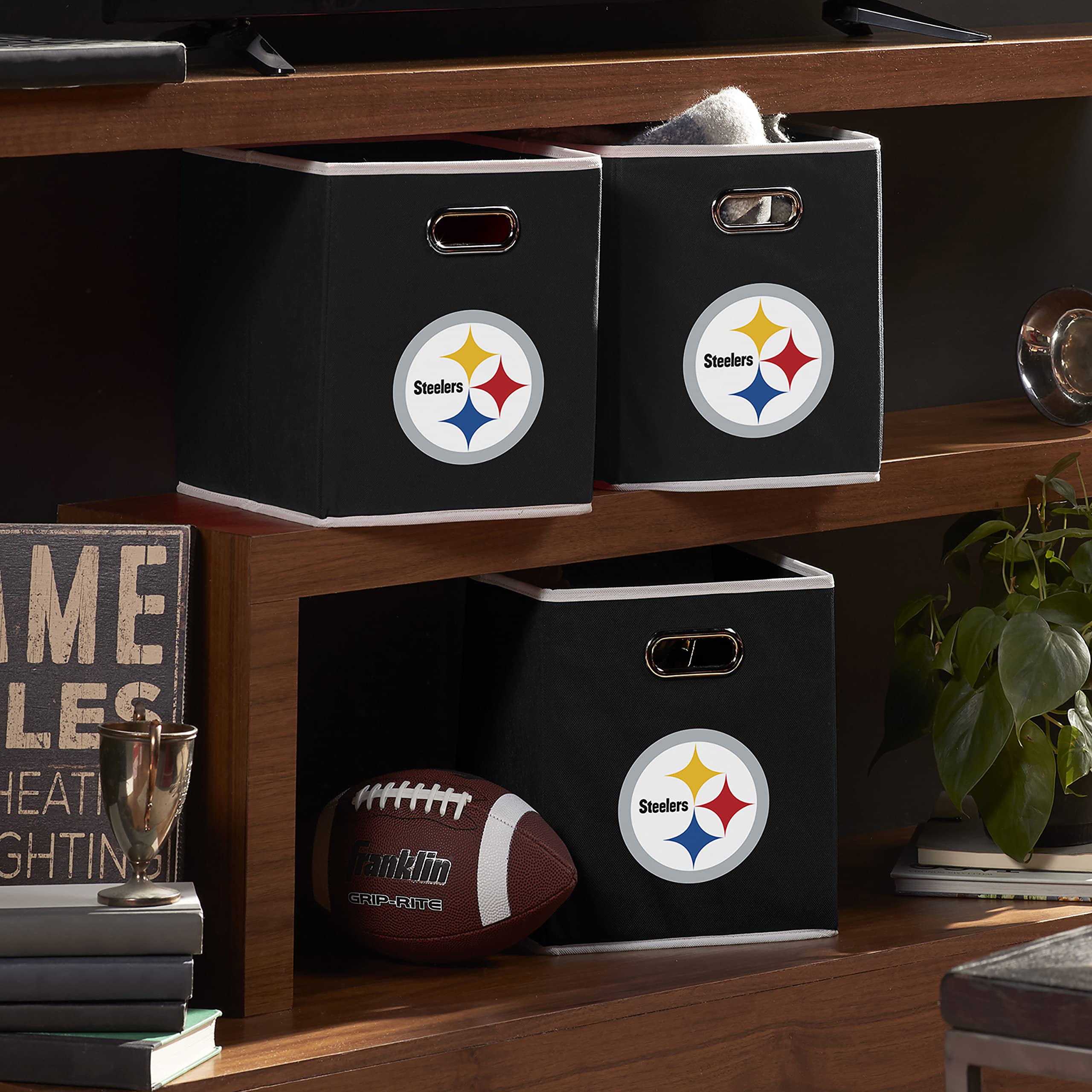 Franklin Sports bin beside books illustrating 11" x 10.5" scale for cube organizers