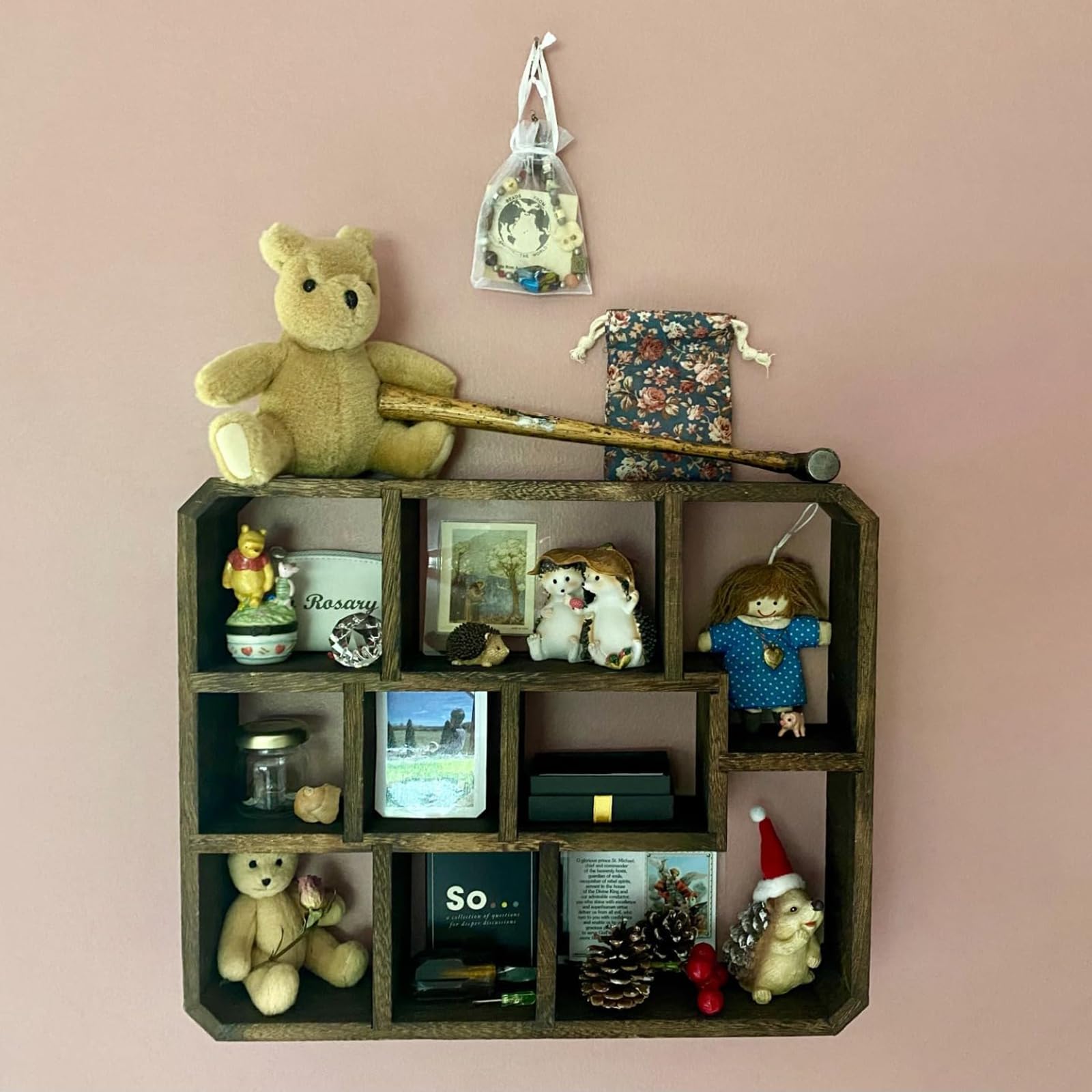 Frcctre scale with mini objects illustrating capacity for plants, frames, and trinkets