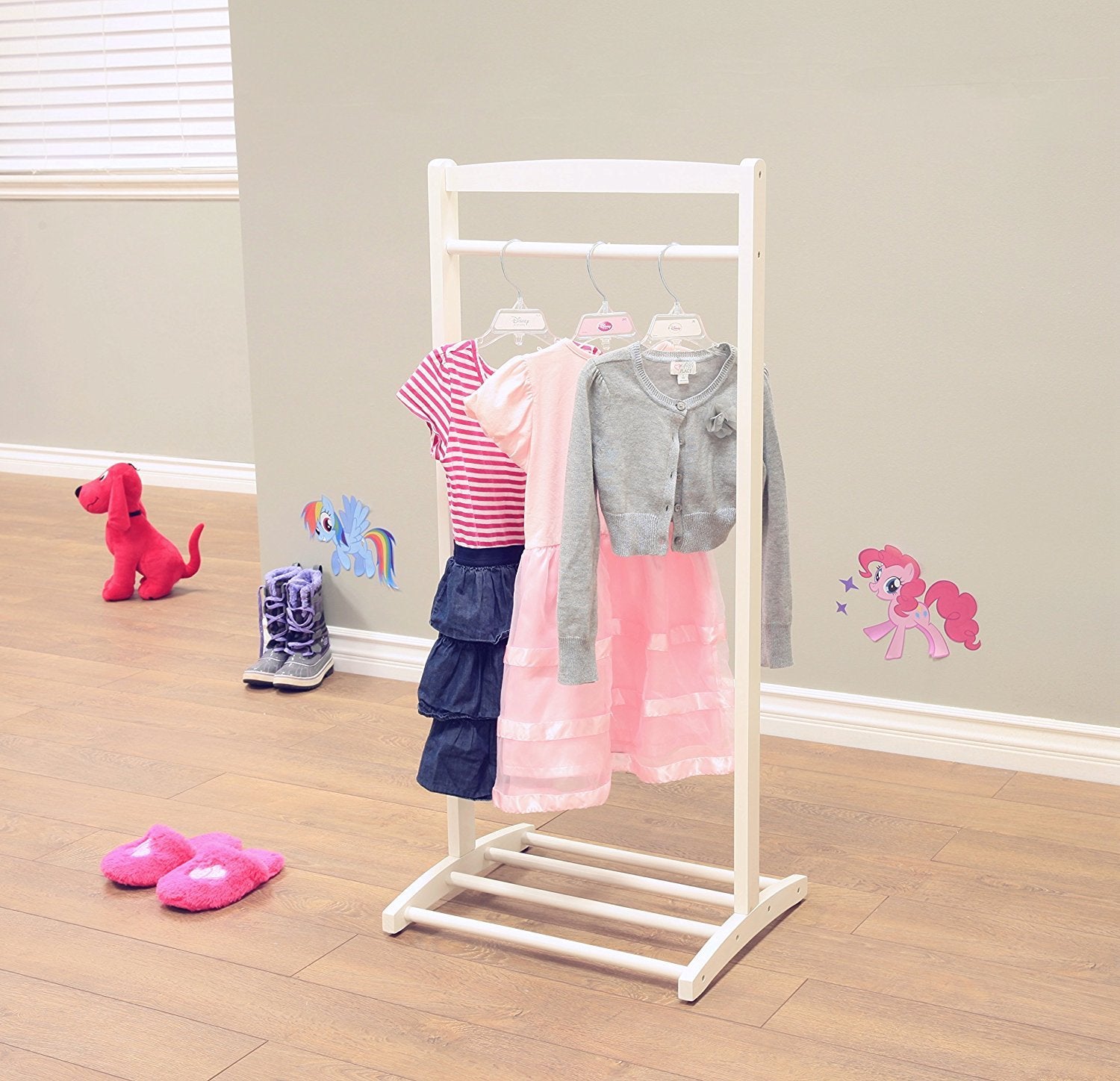 Frenchi furniture coat rack placed in child's bedroom demonstrating organized space and easy access