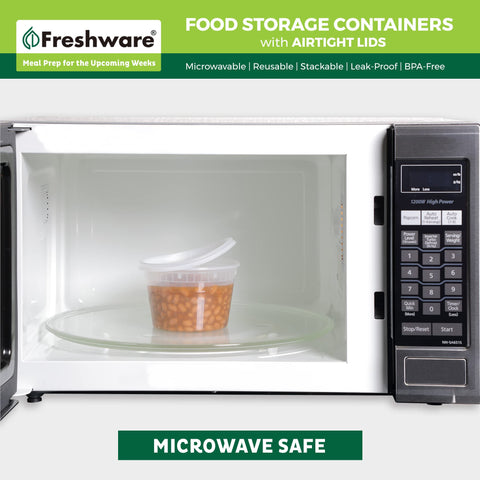 Freshware container in microwave with lid slightly lifted for safe reheating
