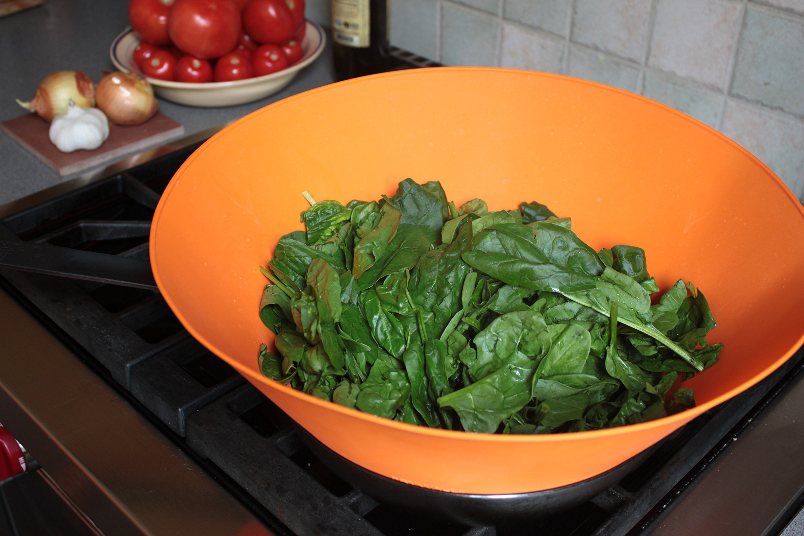 Frywall edge sitting inside pan rim showing correct 12-inch fit