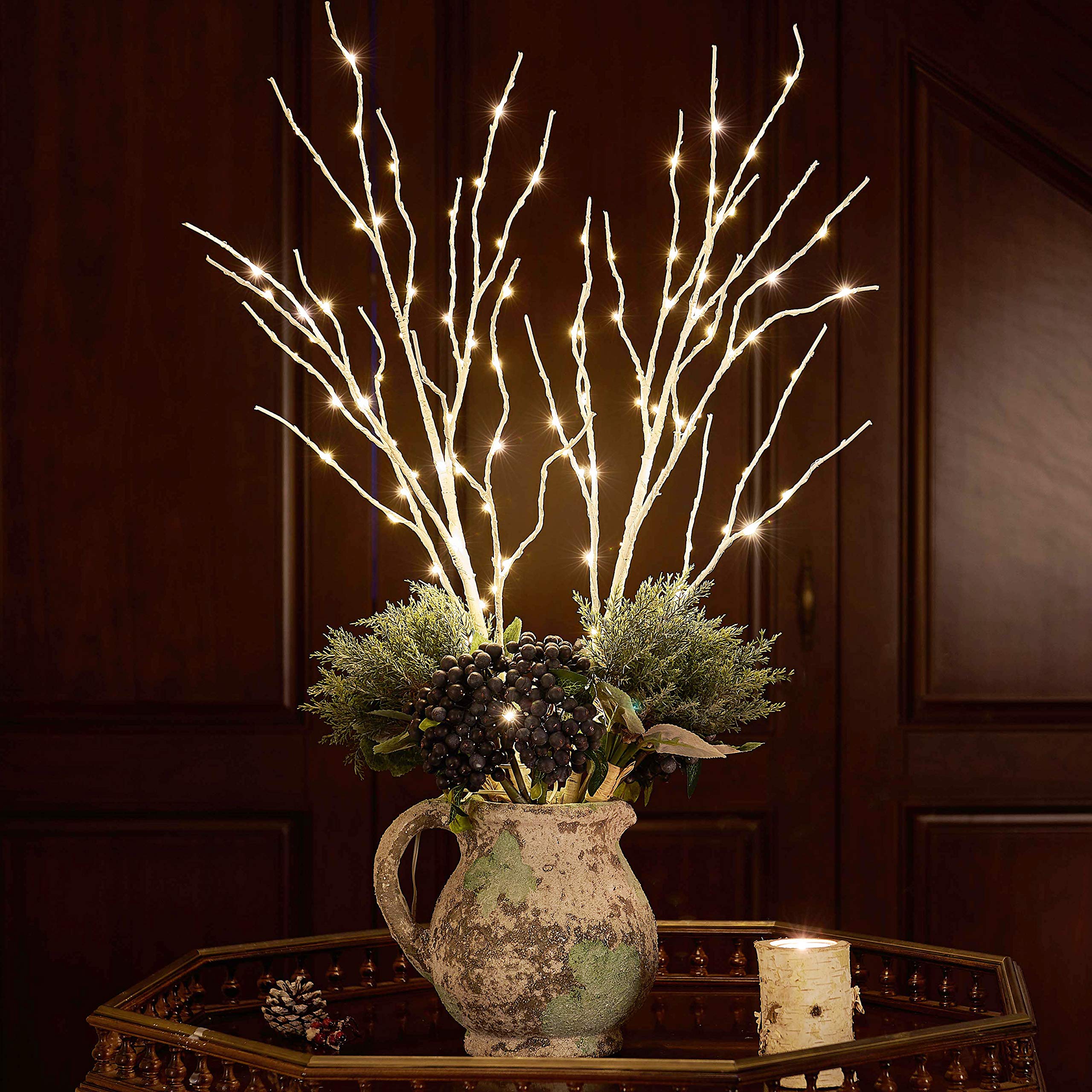 Fudios branches styled on a dining table creating cozy party atmosphere