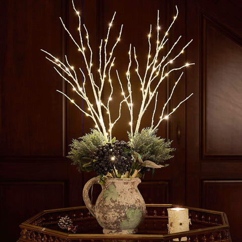 Fudios branches styled on a dining table creating cozy party atmosphere