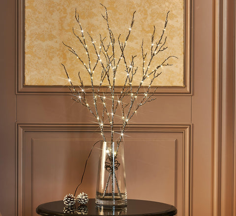 Fudios outdoor patio shelf at night with branches creating cozy ambient lighting benefit