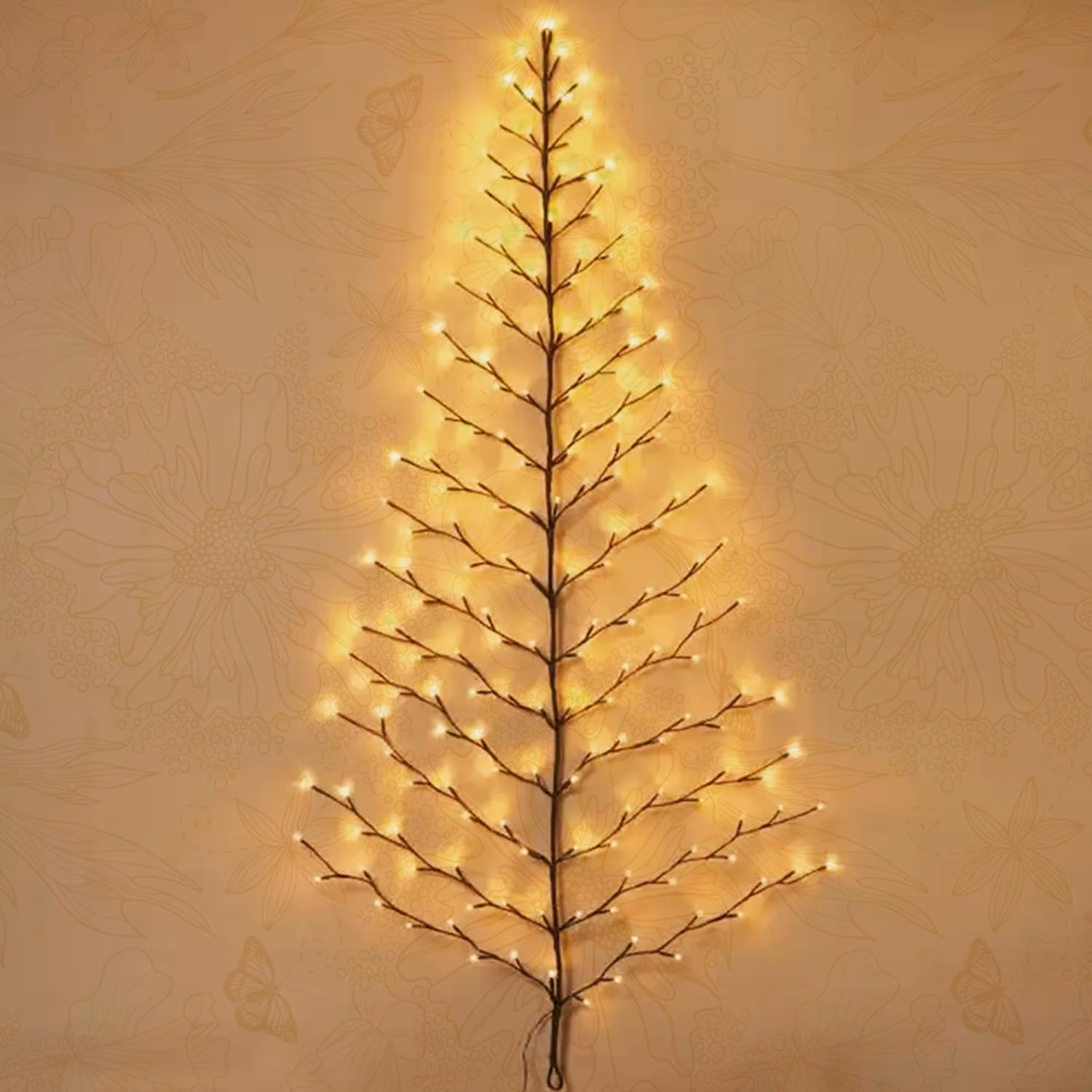 Fudios tree next to sofa showing scale and space-saving benefit