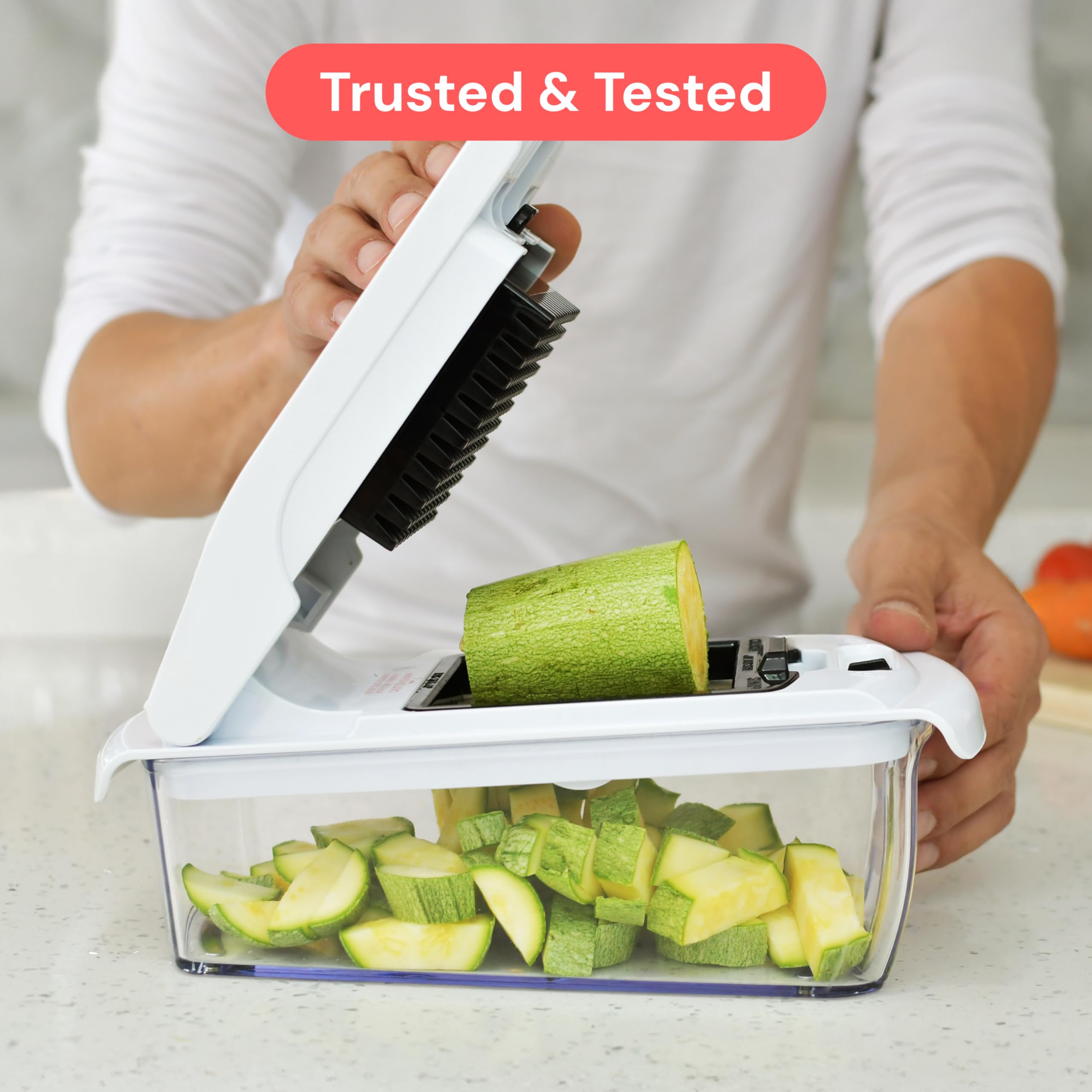 Fullstar Pro next to an apple to show compact size and practical scale
