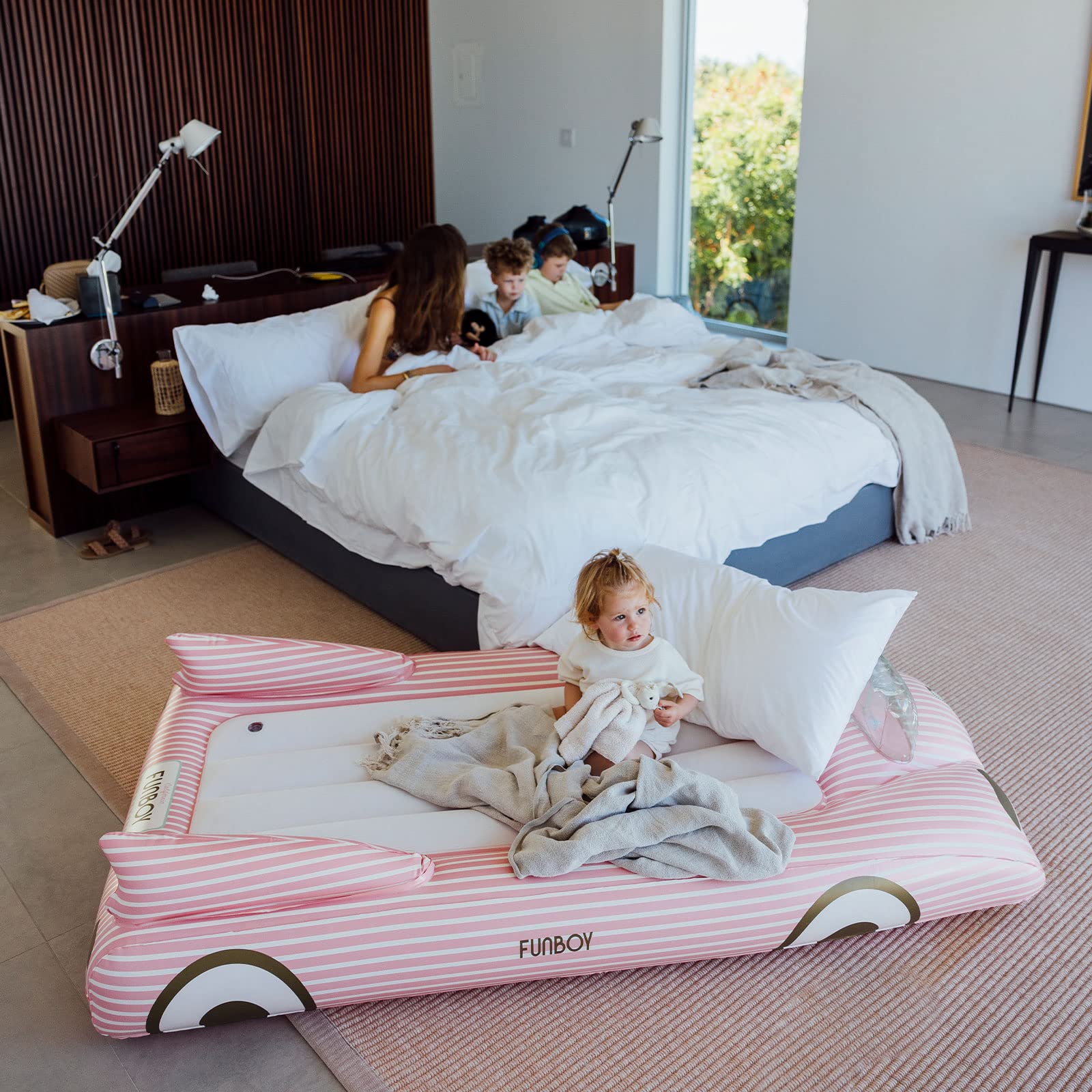 FUNBOY child sleeping on pink bed demonstrating comfortable overnight use