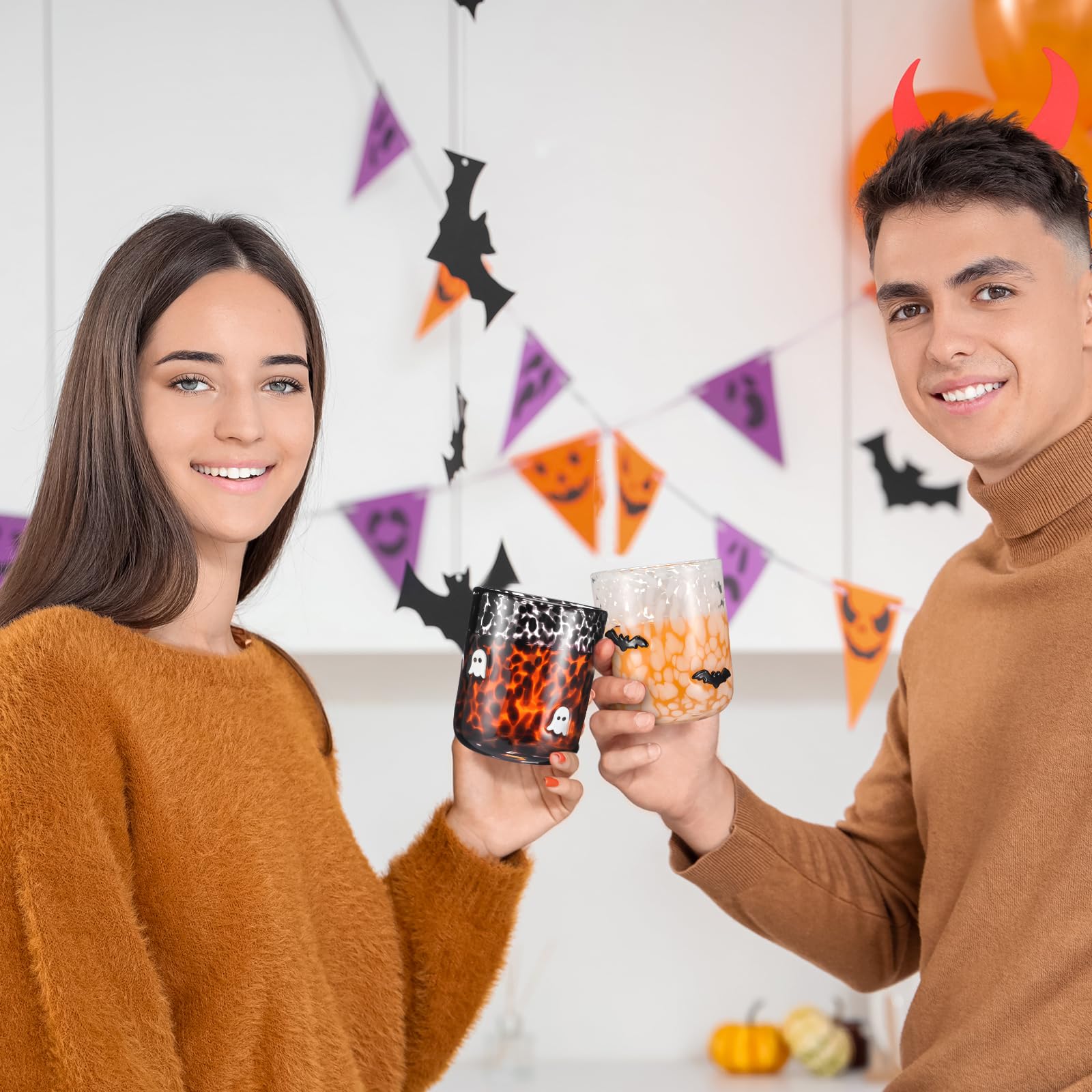 Funnymoom black ghost cup beside pumpkin decor creating seasonal table charm