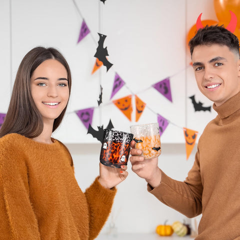 Funnymoom black ghost cup beside pumpkin decor creating seasonal table charm