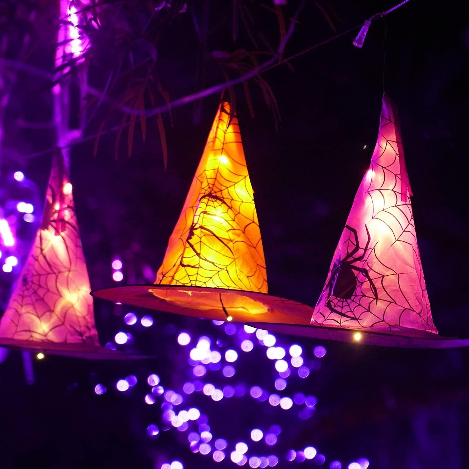 FUNPENY hand holding one witch hat to show size and lightweight design for fast hanging