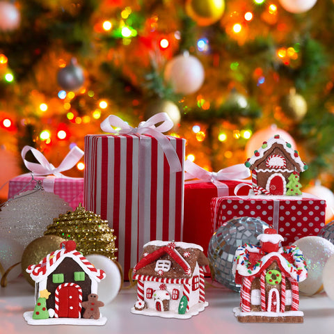 Funtery ornaments styled on a mantel with garland providing cozy decor