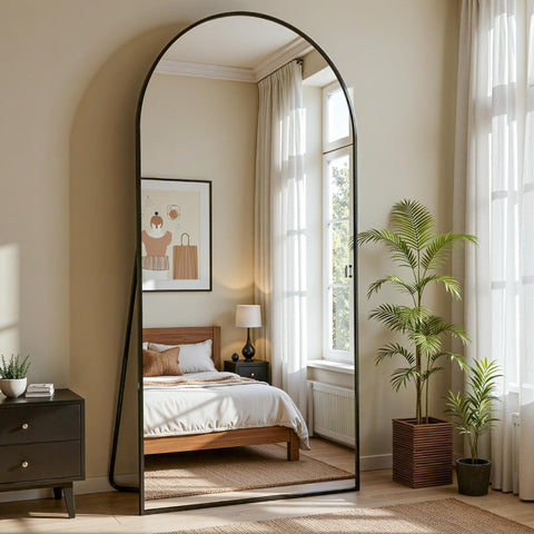Furnbar mirror leaning in a styled bedroom to enhance space and reflect light