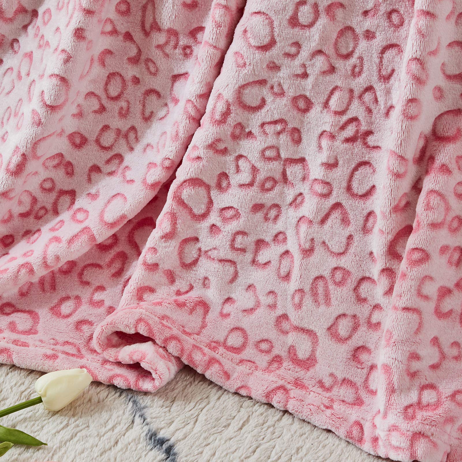 FY FIBER HOUSE blanket draped on queen bed adding warmth and decorative style