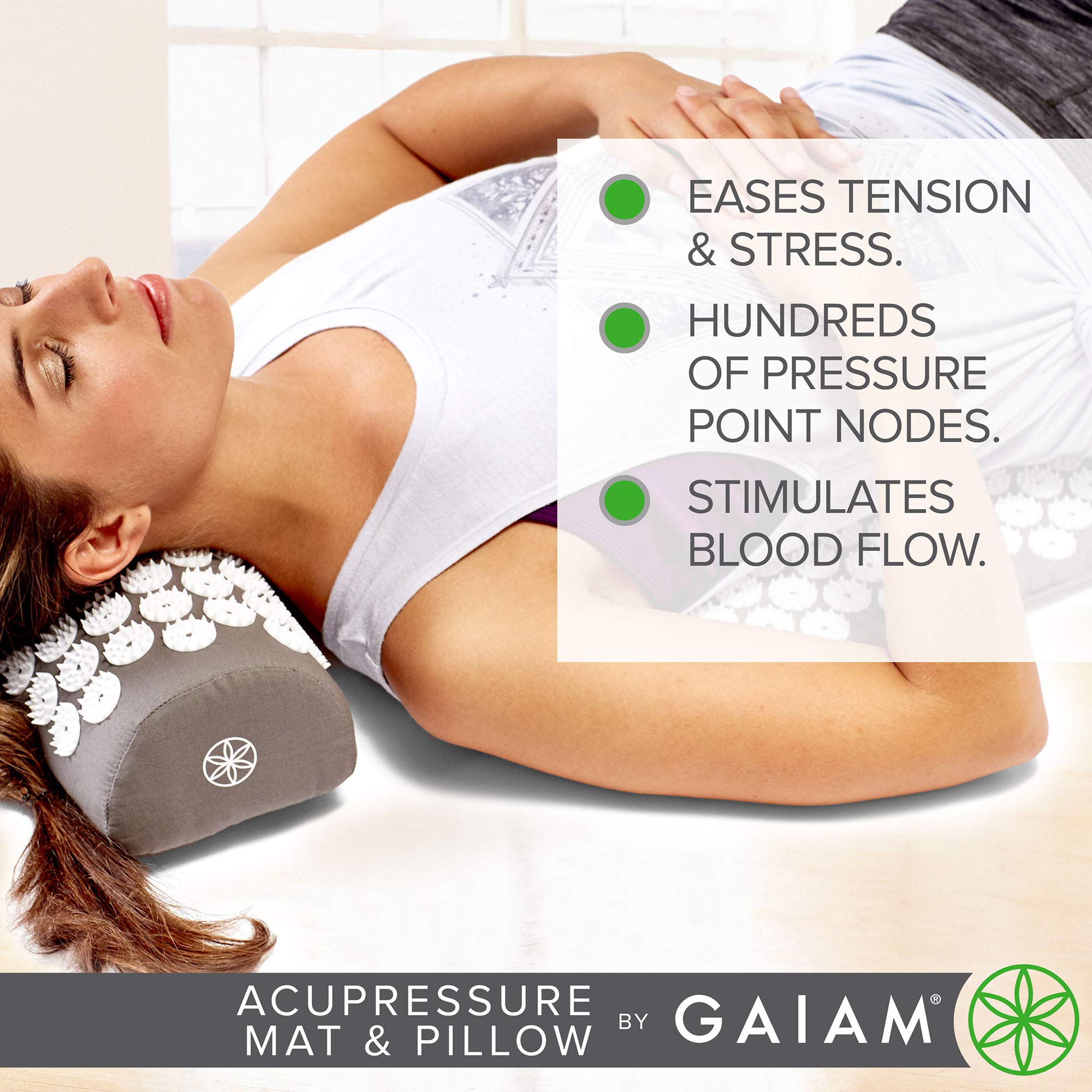 Gaiam pillow under neck in use illustrating posture support and calming effect