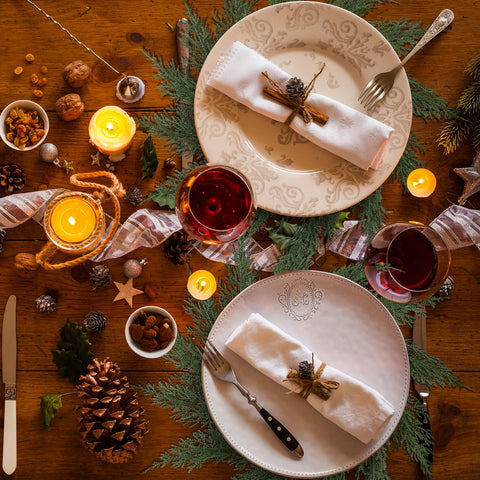 Gandeer placemat beside dinnerware showing scale and fit benefit