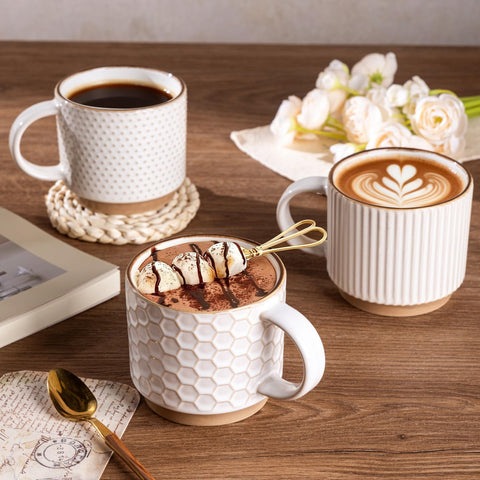 GBhome hand holding a mug to show size and comfortable rim for easy sipping benefit