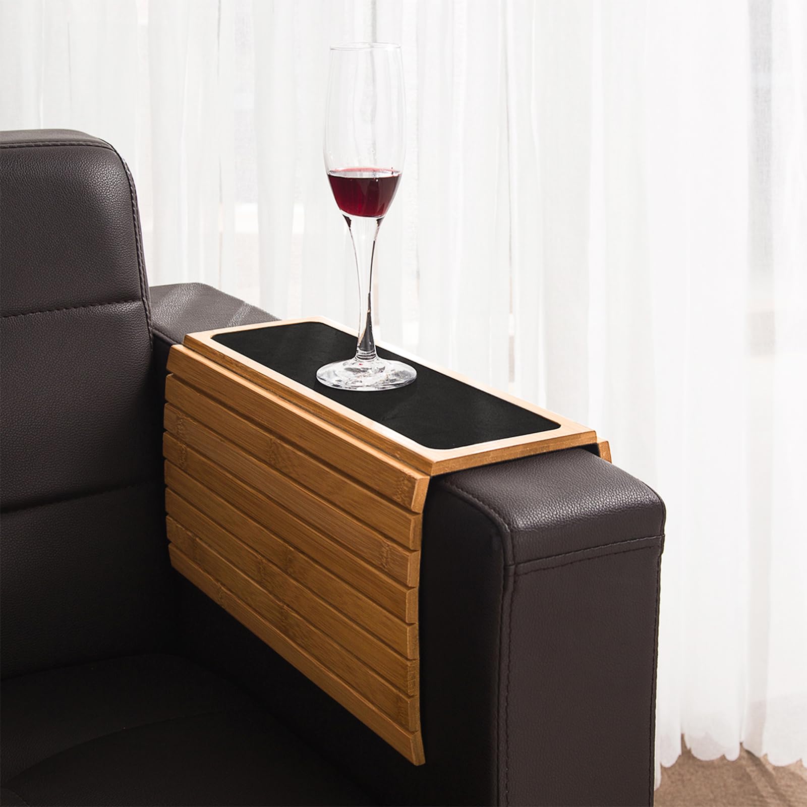 GEHE holding a drink and remote illustrating organized convenience