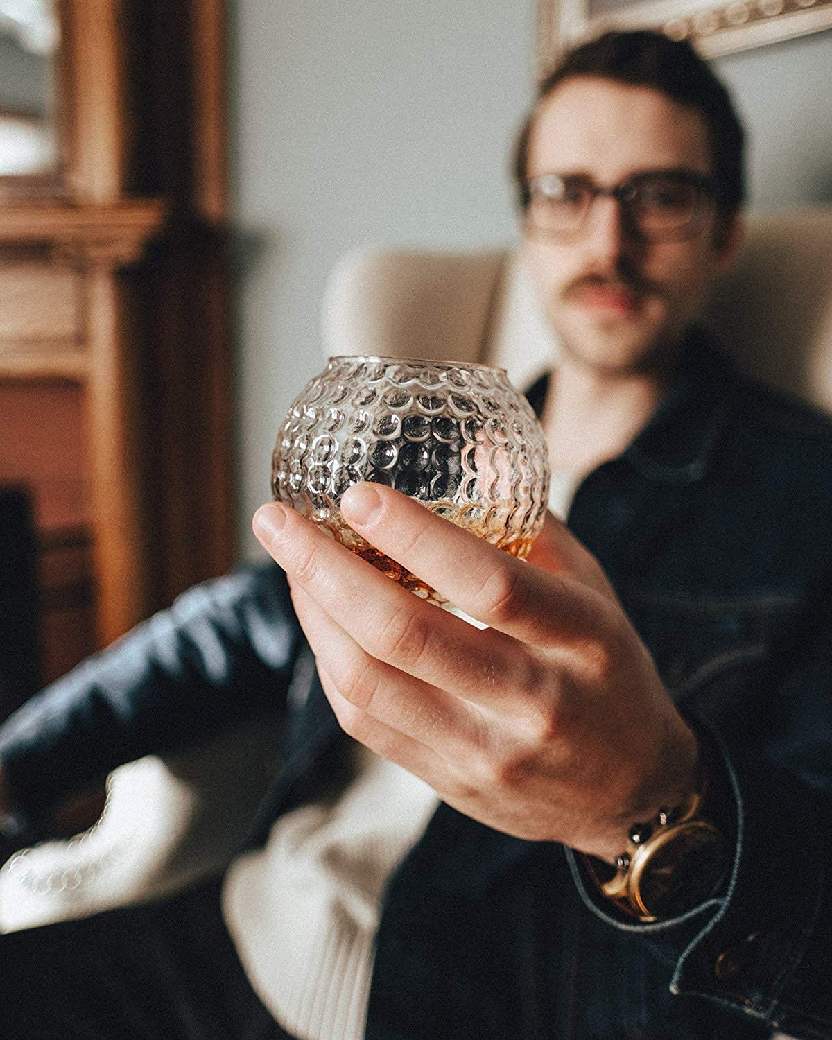 Gemsho Glass held in hand to show 10 ounce scale and comfortable grip