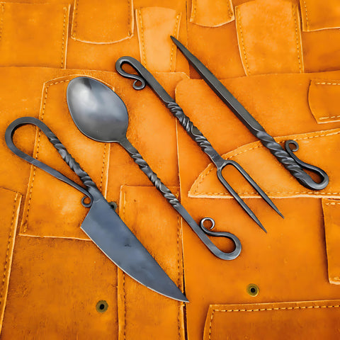 Generic front view feast set showing full Viking silverware and leather roll for authentic dining