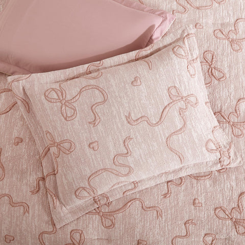 Geniospin styled bedroom angled shot showing elegant pink bedding creating a cozy retreat