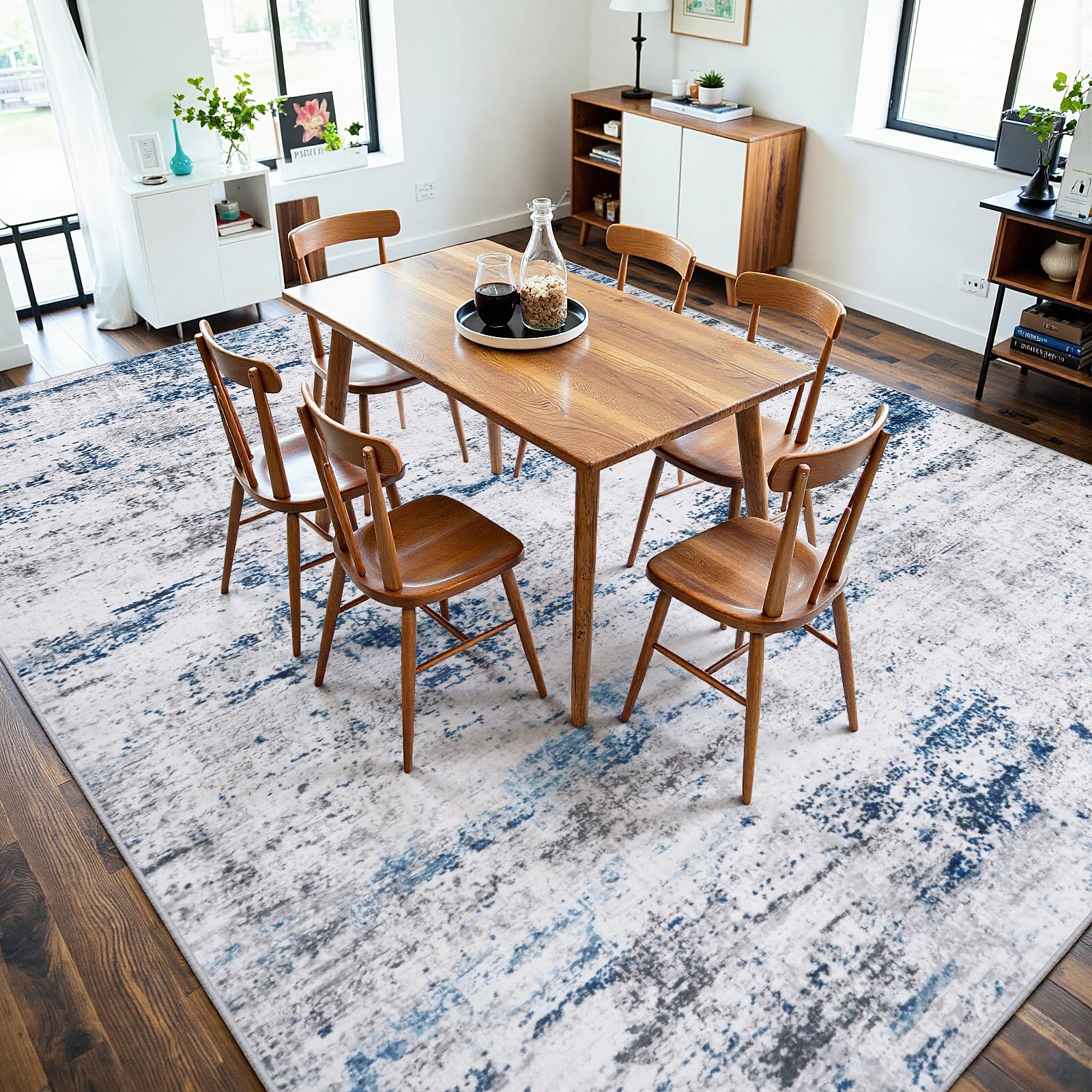 Gent drizz rug beside sofa illustrating 8x10 scale and proper room coverage benefit