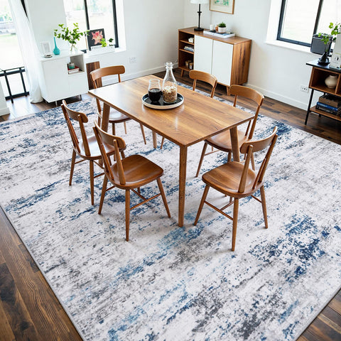 Gent drizz rug beside sofa illustrating 8x10 scale and proper room coverage benefit