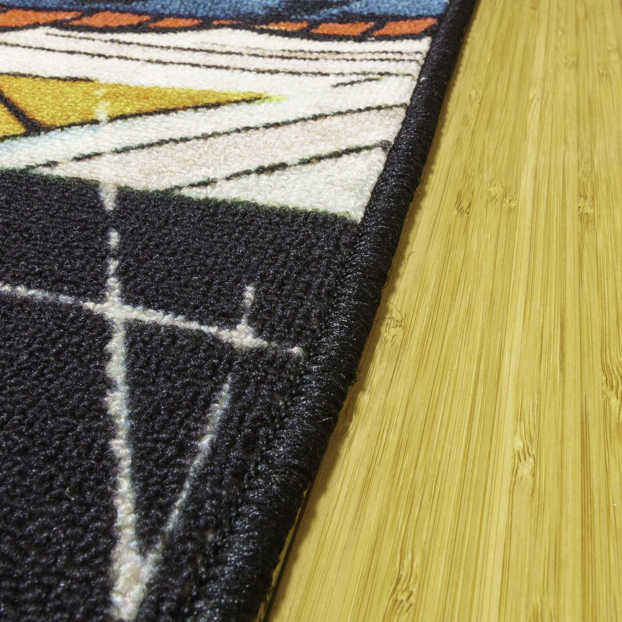 Gertmenian rug beside toys showing scale and a generous play area benefit