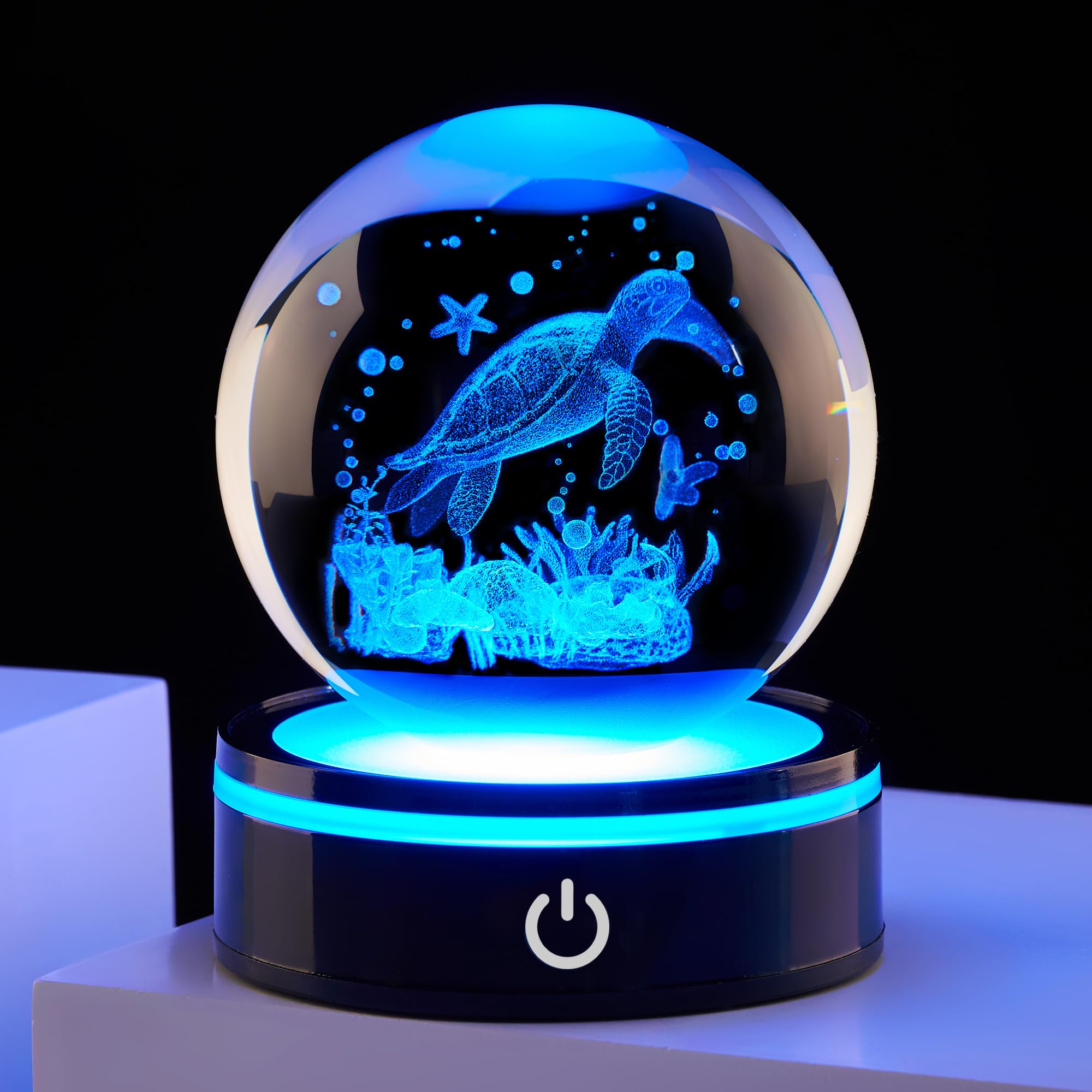 Ghtixsu front view crystal ball showing clear turtle engraving and sparkle