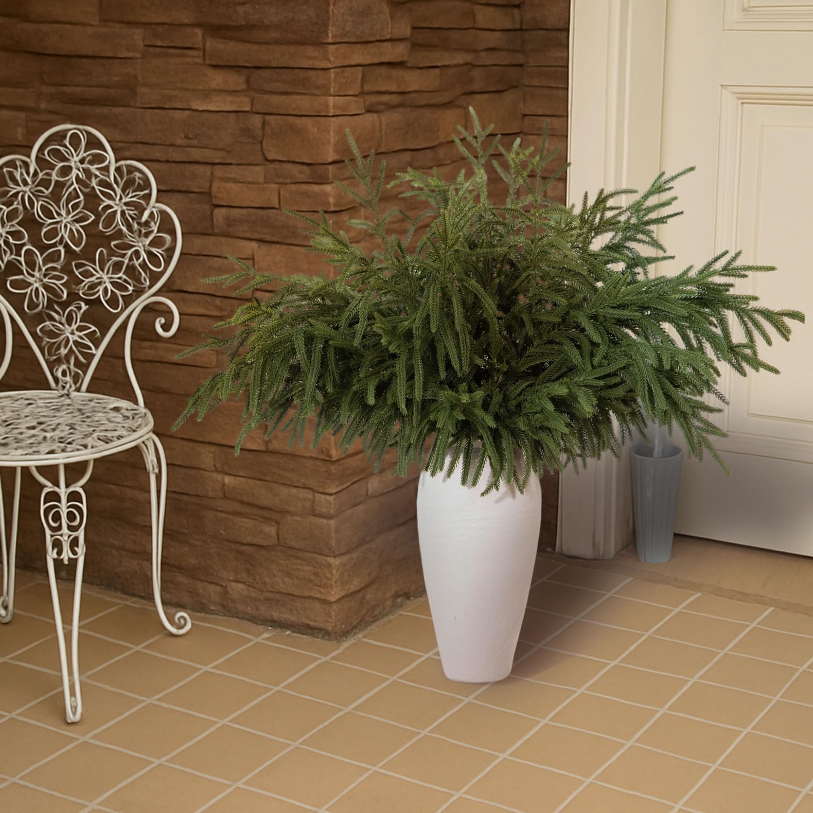 GIAUMA stems arranged in a tall vase adding instant seasonal height and impact