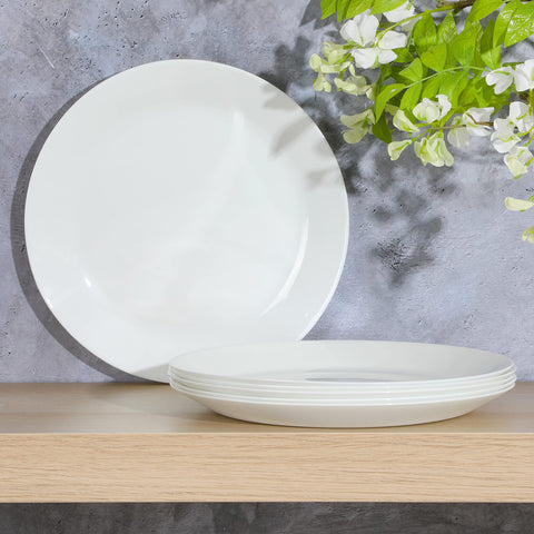 Gibson Home plate presented with salad and entree in a dining setting to show presentation and microwave-safe convenience