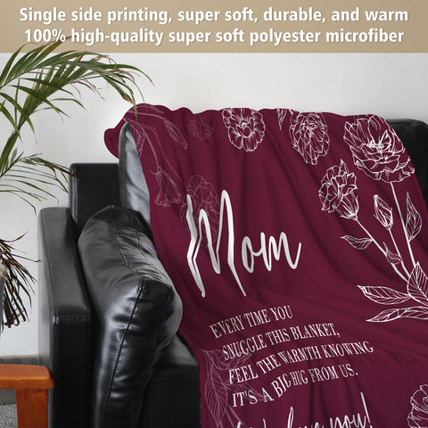 GiltGlimmer folded blanket next to a book to show generous 60x80 size