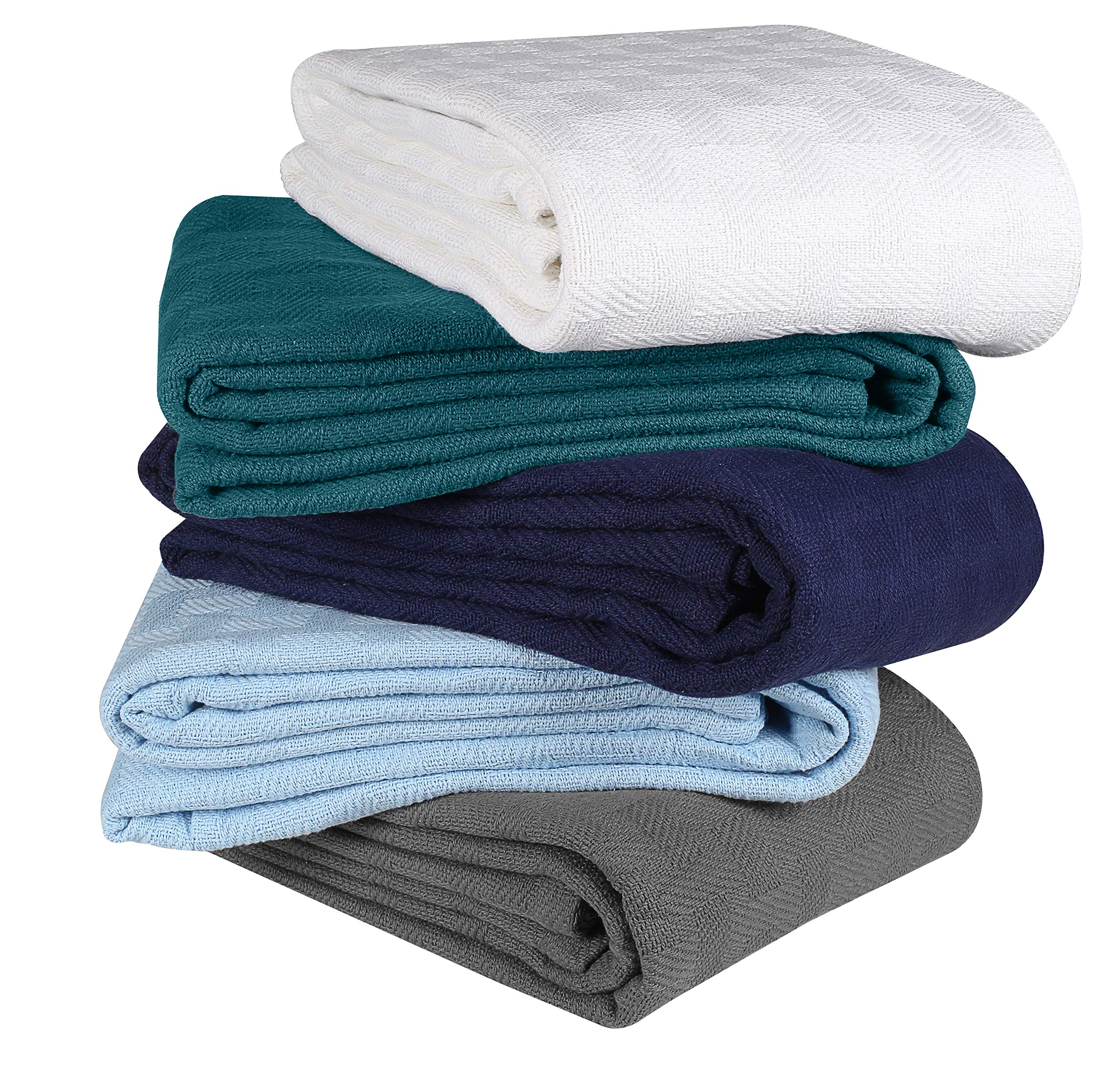 GLAMBURG blanket styled on bed illustrates layering and cozy bedroom aesthetic