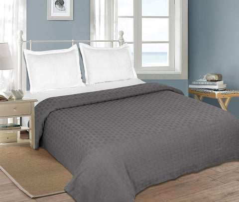 GLAMBURG blanket beside measuring tape illustrating 90x90 inch queen scale