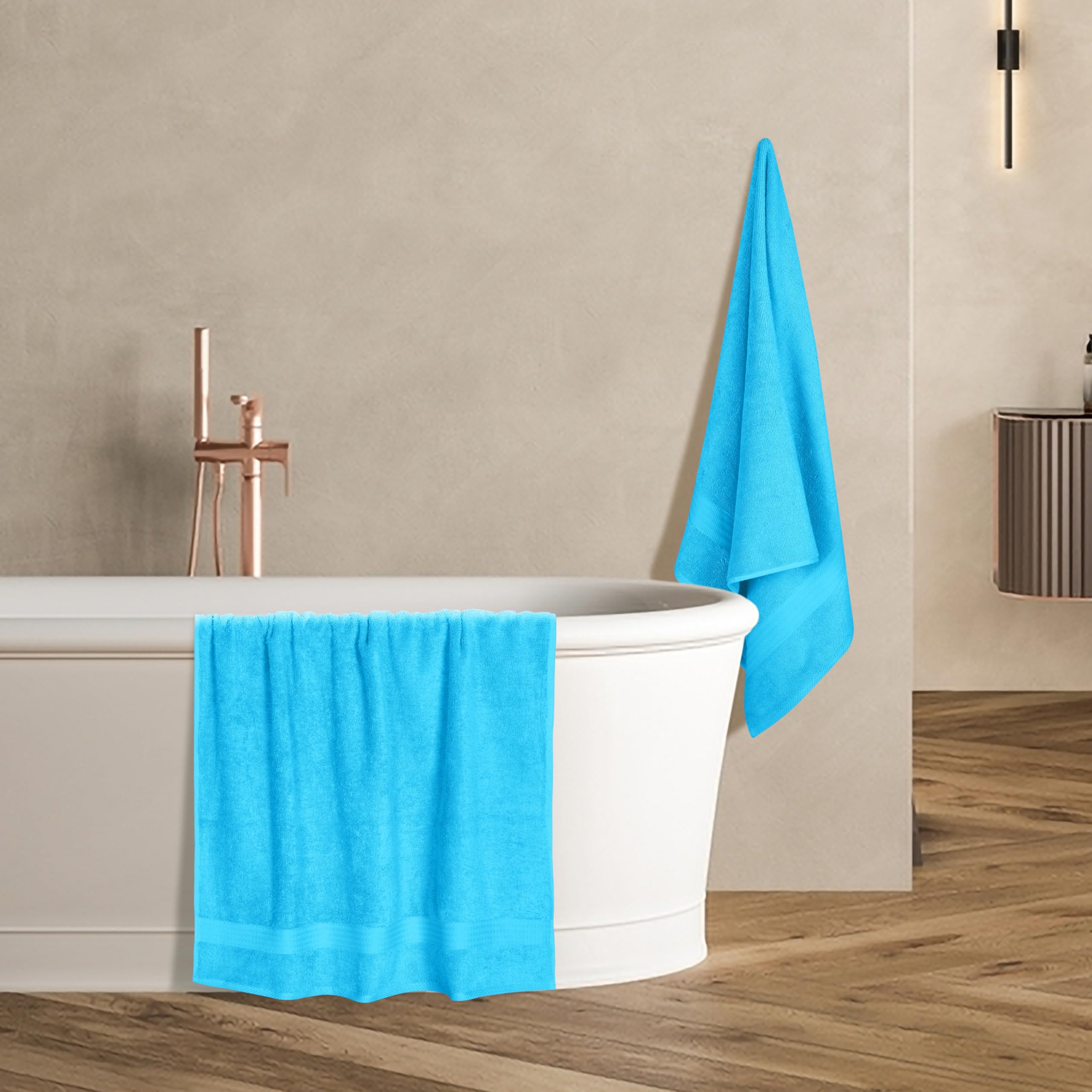 GLAMBURG towel laid on bathmat showing true 27x54 size benefit