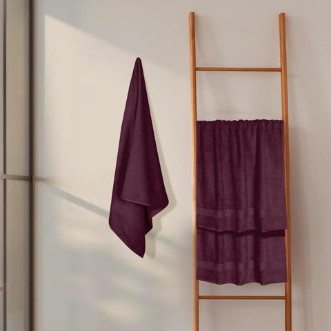 GLAMBURG towel beside ruler illustrating 27x54 inch size and practical scale