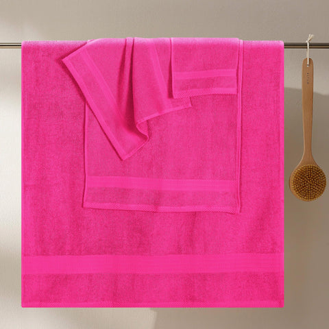 GLAMBURG neatly stacked towels displaying coordinated hot pink set and organization benefit