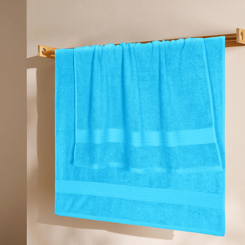 GLAMBURG folded towel stack on shelf demonstrating neat storage benefit