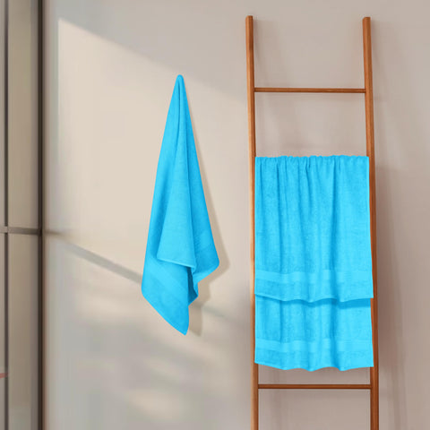 GLAMBURG person drying hair with towel showing quick absorbency benefit