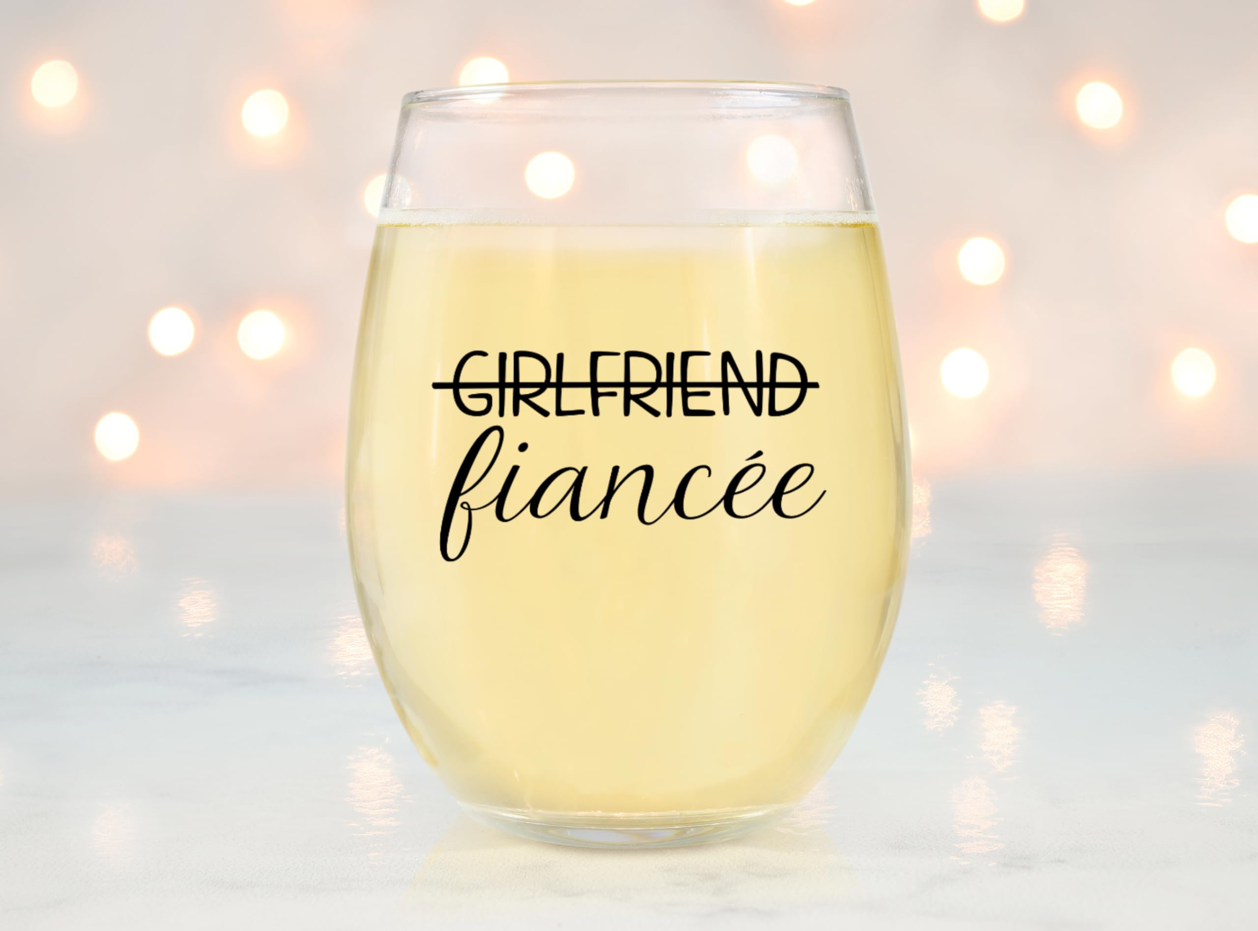 Glassicle lifestyle tabletop toast with couple using glasses to celebrate