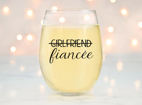Glassicle lifestyle tabletop toast with couple using glasses to celebrate