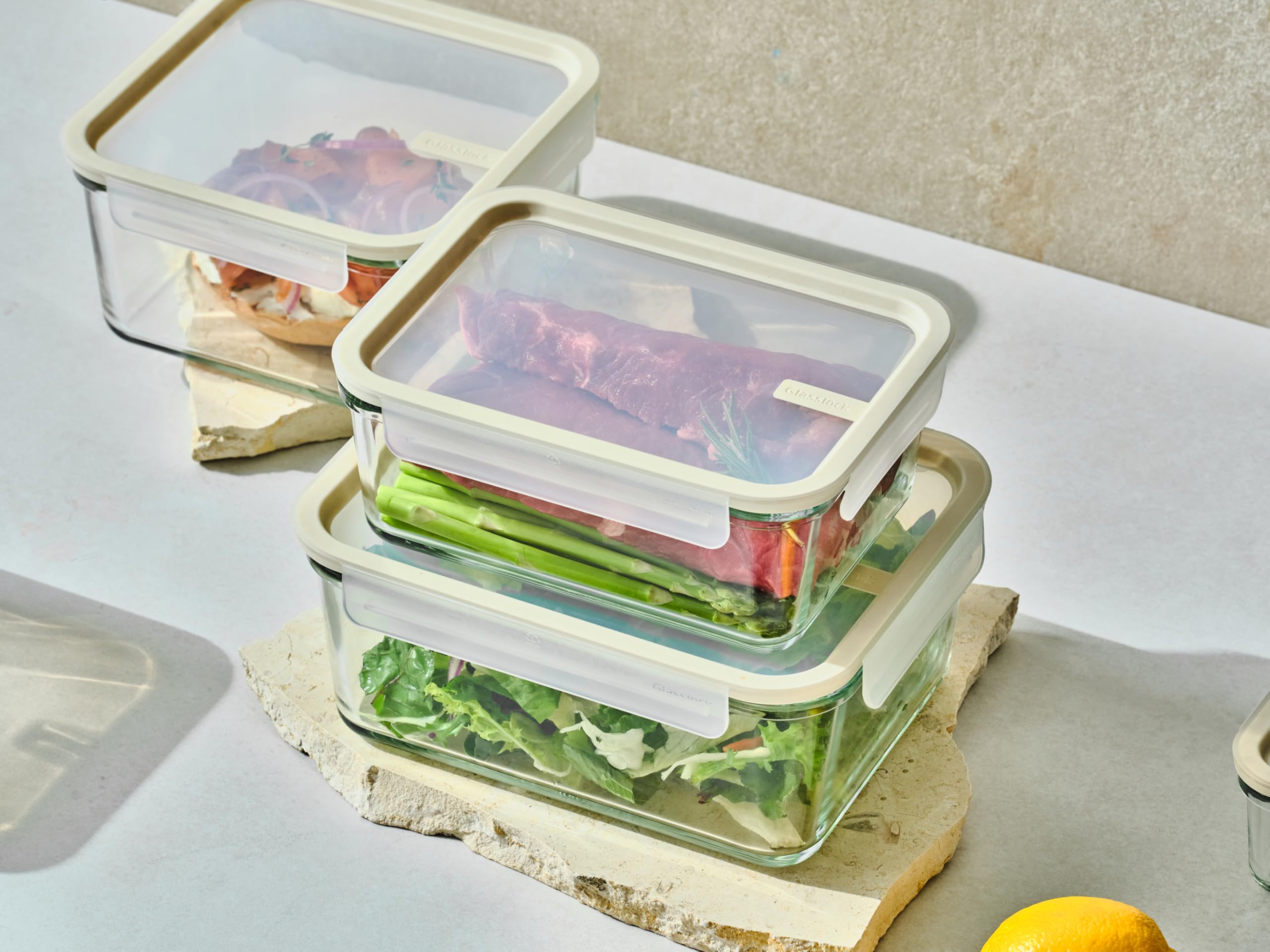 Glasslock containers next to an apple showing scale for portioning
