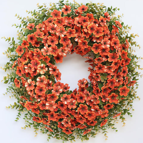 GLIDLION front view of fall wreath showing full orange-red blooms and welcoming benefit