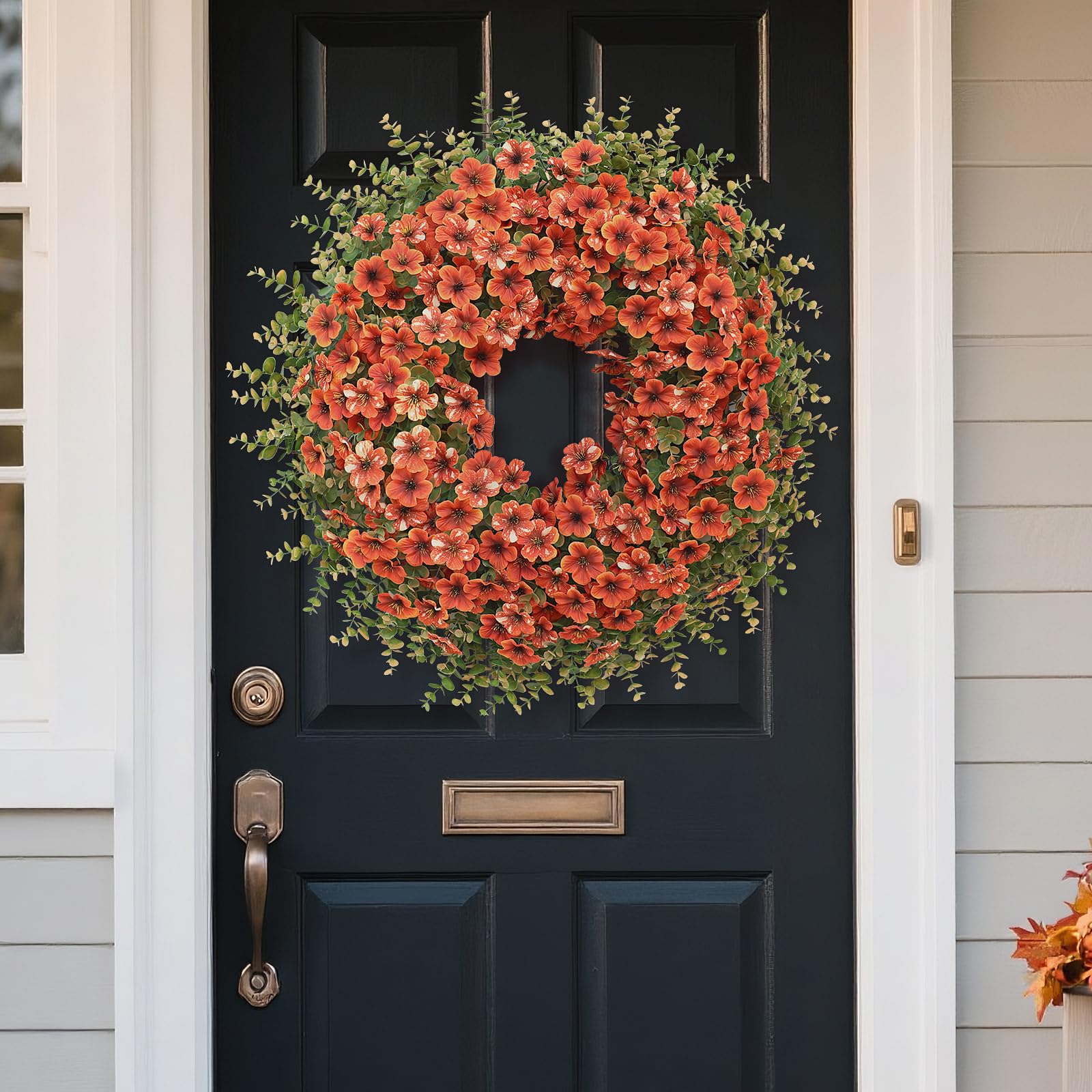 GLIDLION wreath next to door for size comparison showing 26-inch scale and fit benefit